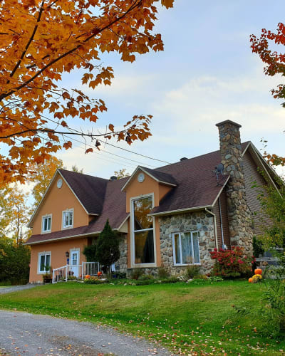 Exterior of the Gîte L'Antre d'Eux in autumn.