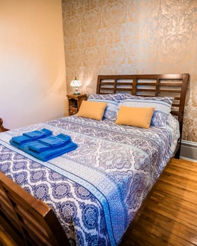 Bedroom at the Aux Plaisirs Partagés B&B.