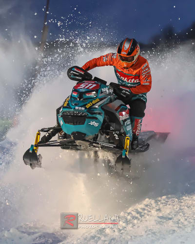 Snowmobile jumping at Grand Prix Ski-Doo de Valcourt.