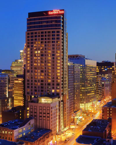Hilton Garden Inn Montréal Centre-Ville illuminated.