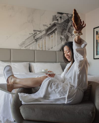 A woman in a hotel room.