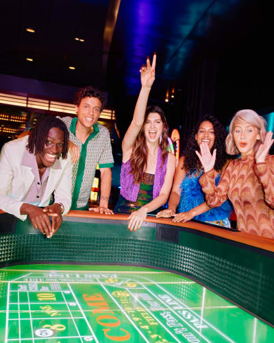 A group of friends having fun at the casino.