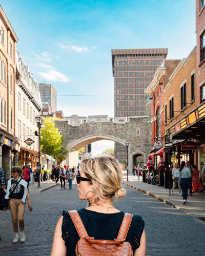 A woman seen from behind, walking in Quebec City.