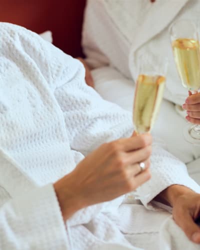 A couple with sparkling wine - Hotel Sepia.