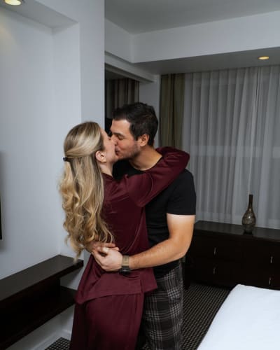 A couple kissing at the Hotel Le Bonne Entente.