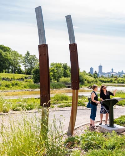 Cartier-Brébeuf National Historic Site - Two adults in a park