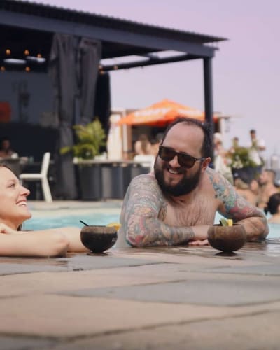 Man and woman in the outdoor pool. 