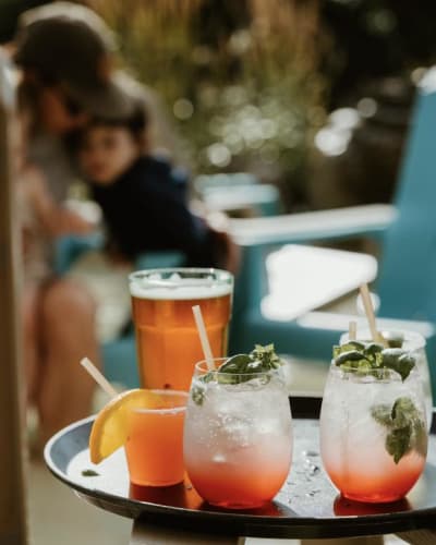 Le Roquemont - A tray of drinks on an outdoor table