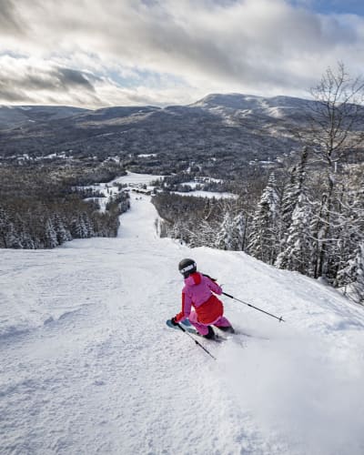 skier going down a ski slope