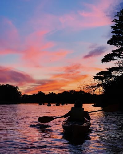 Kayaking at dusk in Parc de la Rivière-des-Mille-Îles.