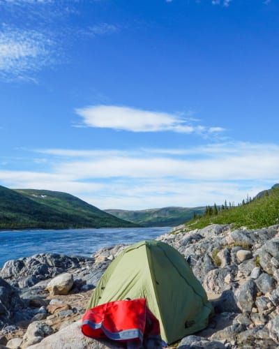 Wild camping by a river.