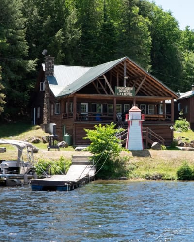 Waterfront and main cottage in the summer.