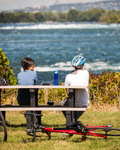 Two people and their bikes at RécréoParc.