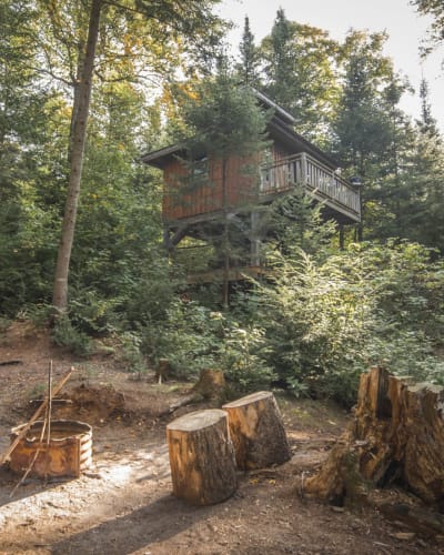 Perched cabin and campfire.