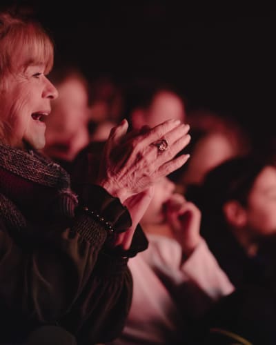 Spectators applauding.