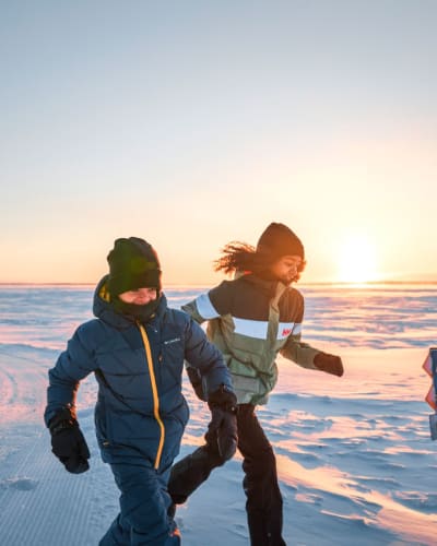 Two kids at Parc National d’Oka in winter.