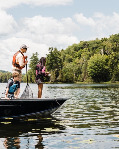 A fishing adventure in Petite Nation - Two adults and two children fishing on a small boat