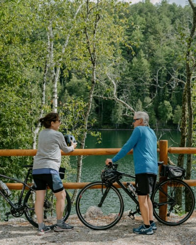 An older couple on bicycles.