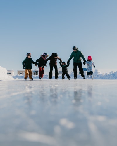 Family skating at the Village sur glace Roberval.