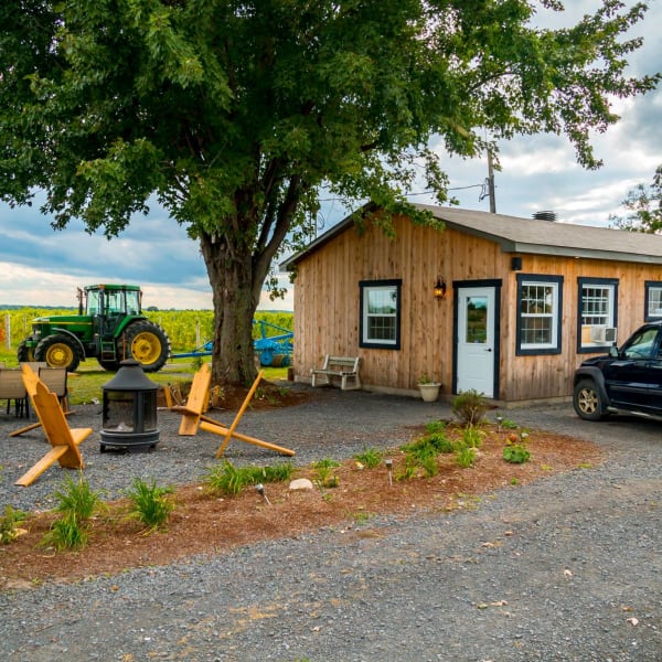Domaine Berthiaume - A wooden building in the countryside.