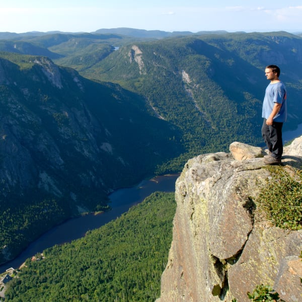 Man at the top of a mountain in the Hautes-Gorges de Charlevoix.