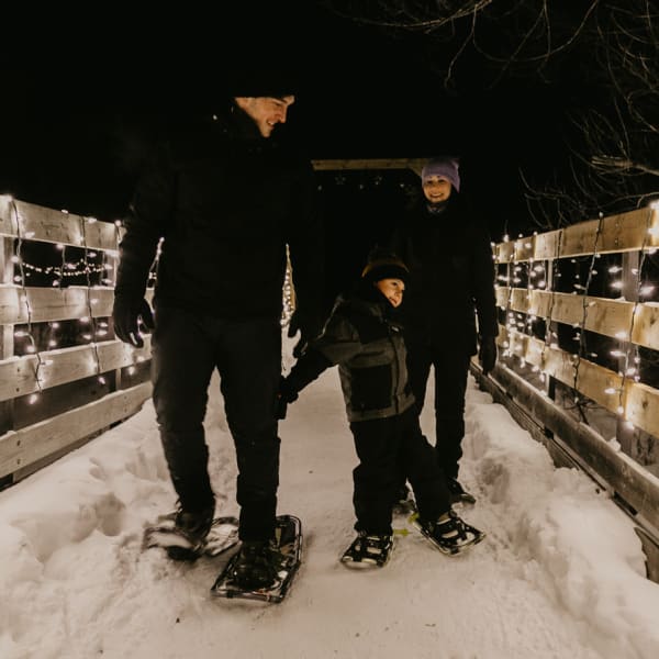 Family on a snowshoe hike.