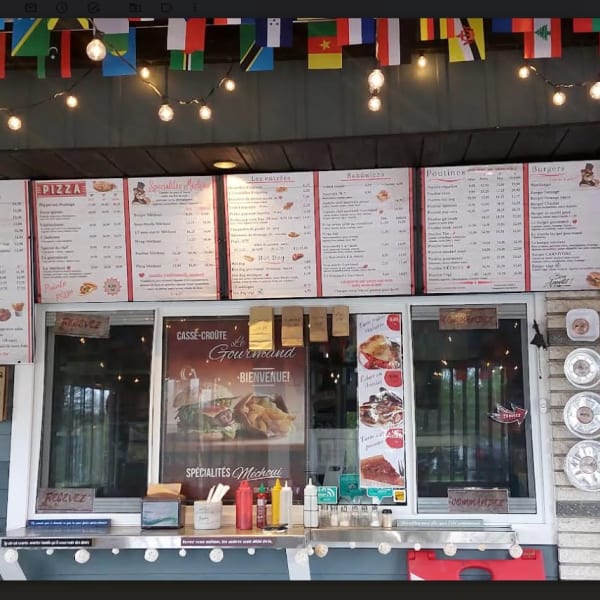 Menu and counter at Casse-croûte Le Gourmand.