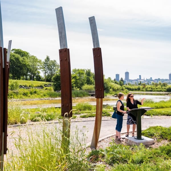Cartier-Brébeuf National Historic Site - Two adults in a park