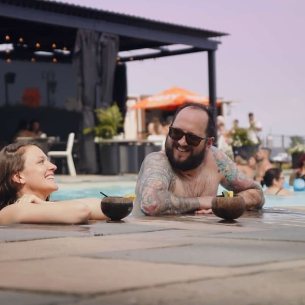 Man and woman in the outdoor pool. 