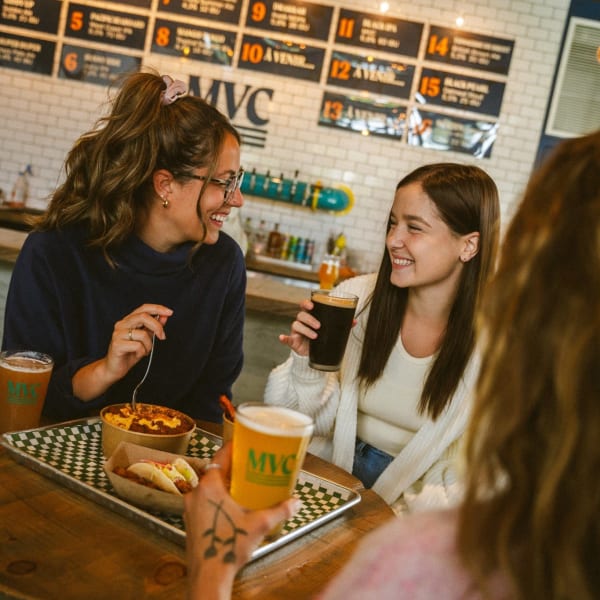 Young woman drinking beer.