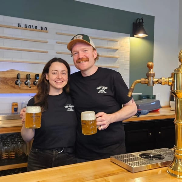 Microbrasserie Loup-Garou - Two people, each holding a beer