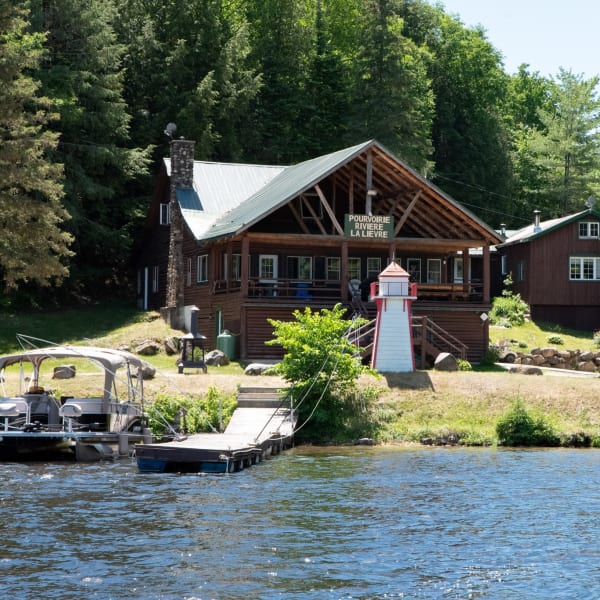 Waterfront and main cottage in the summer.