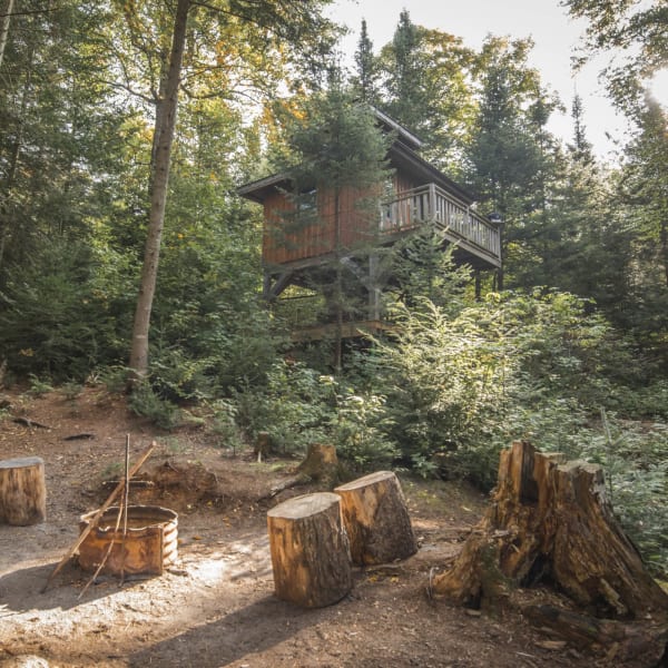 Perched cabin and campfire.