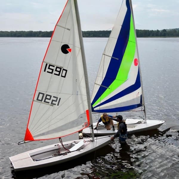 Two sailboats on the Richelieu River.
