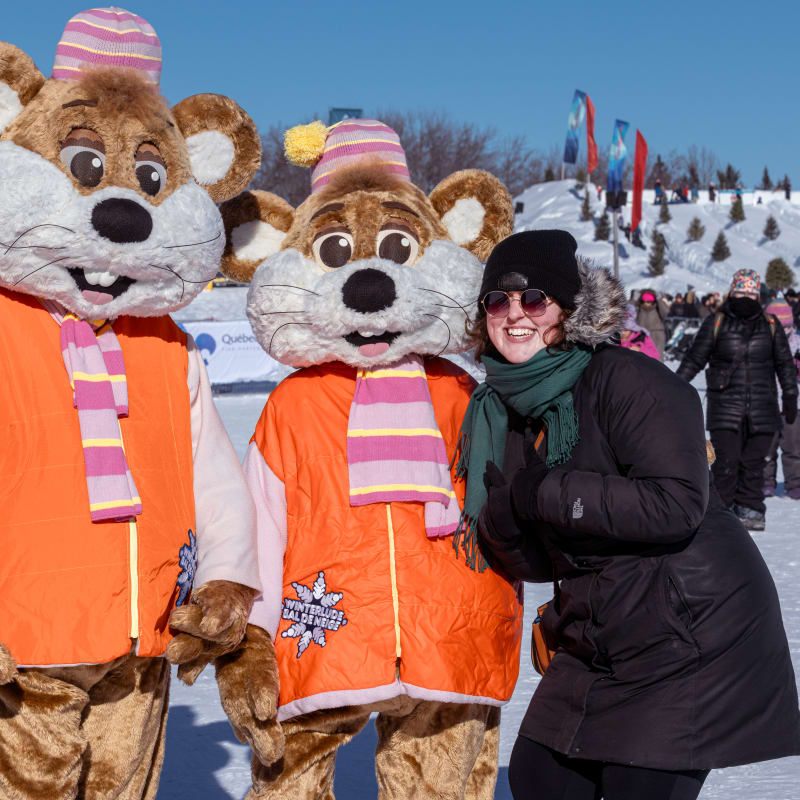 Winterlude - Snowflake kingdom - Woman standing with two mascots