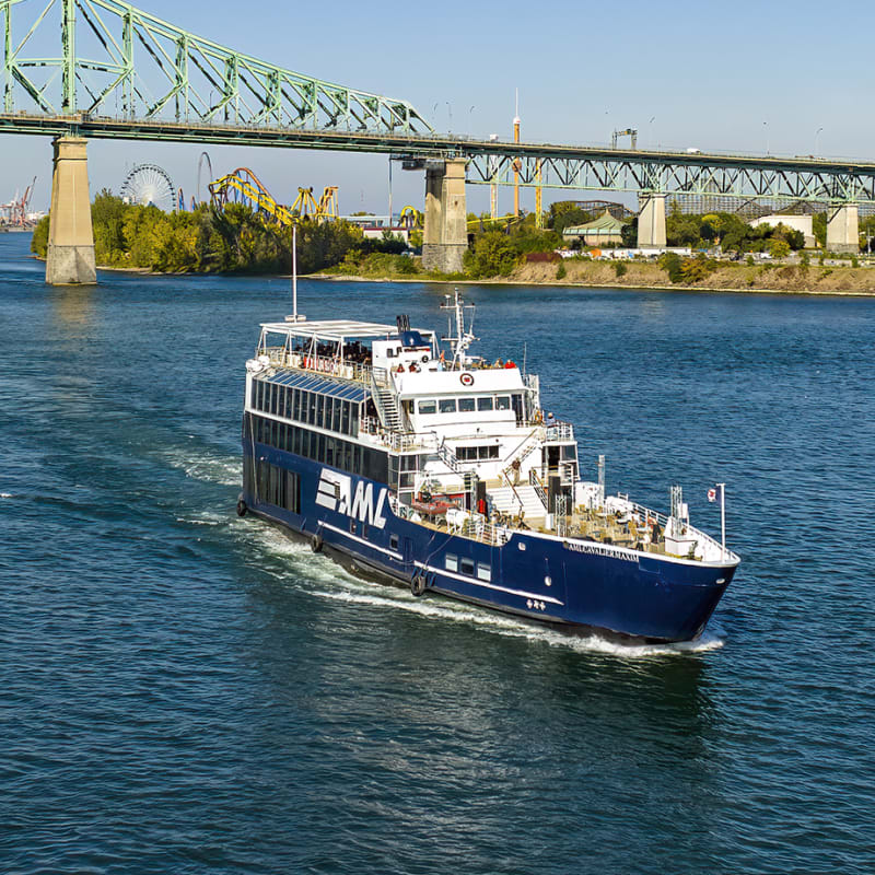 Cruise ship next to a bridge in Montréal.