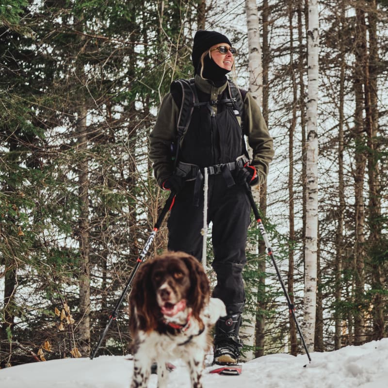 Destination Lac-Saint-Jean a woman walking her dog in the winter