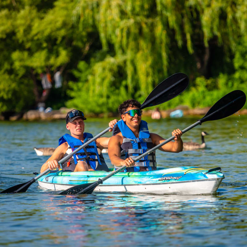 Two men in a tandem kayak