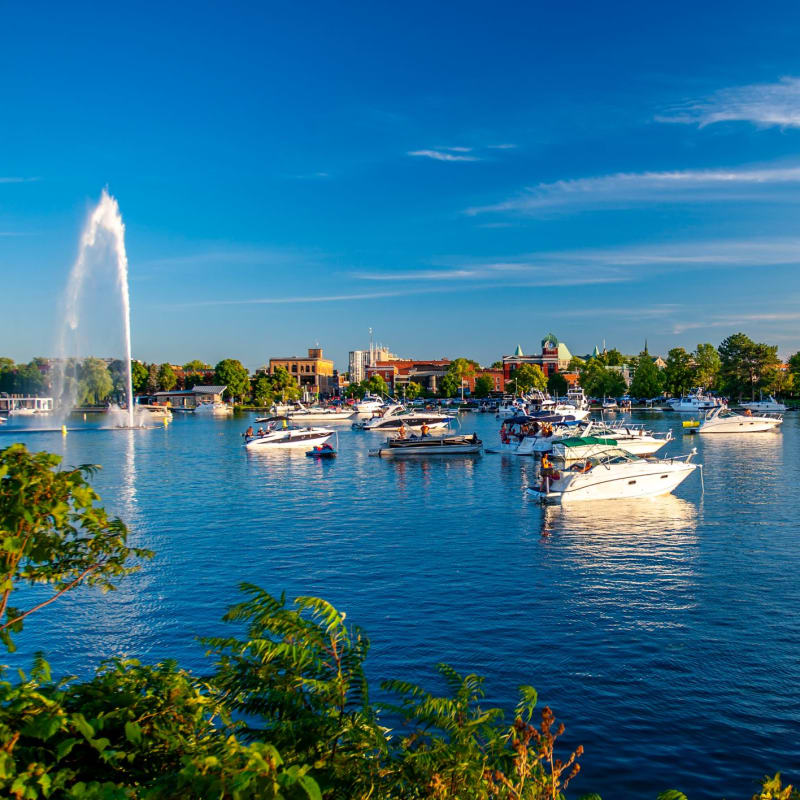 View of a bay with boats and a fountain