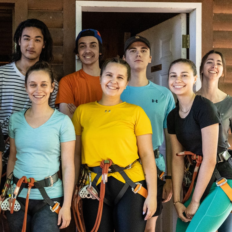 Group of people wearing climbing harnesses