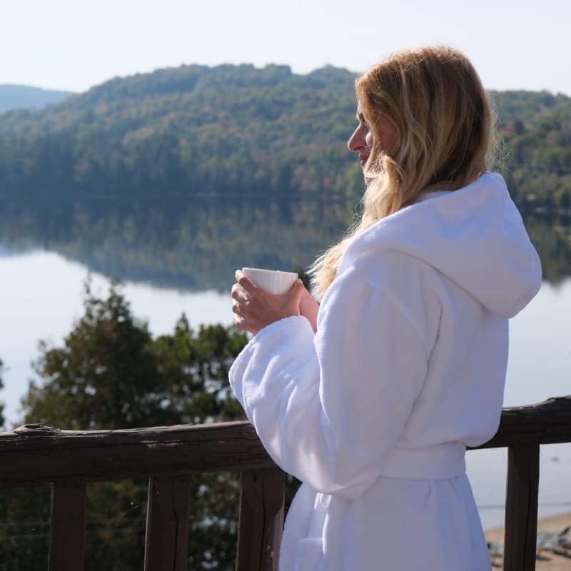 Grand Lodge Mont-Tremblant - Woman in bathrobe on a balcony