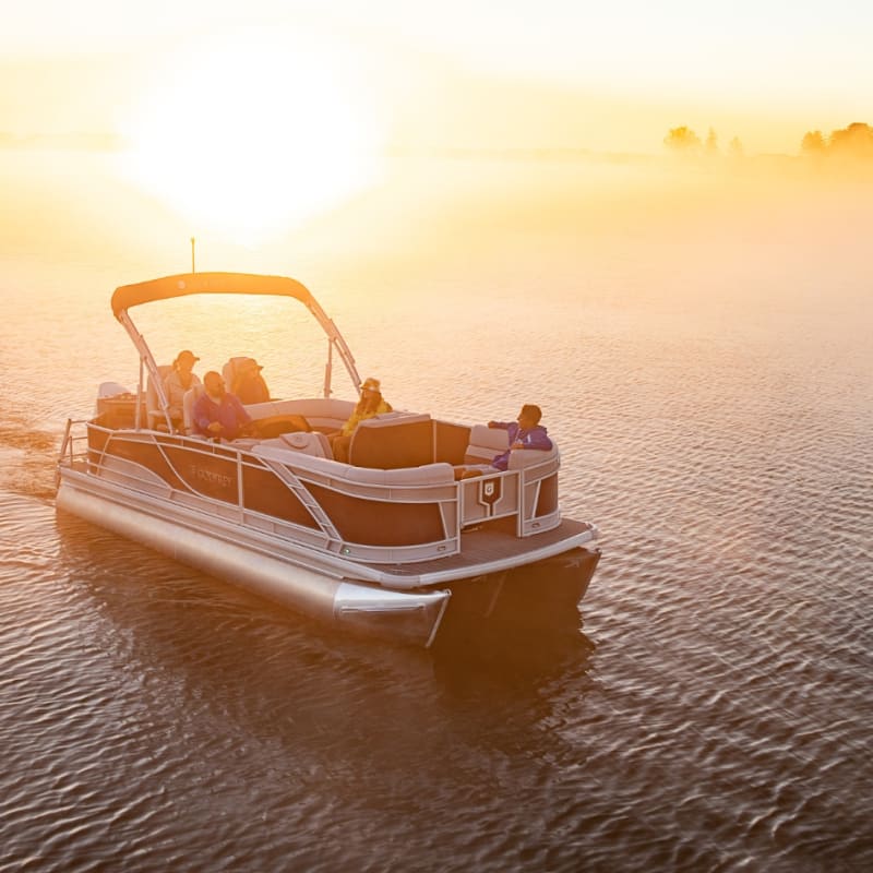 Pontoon on the lake in Magog at sunset.