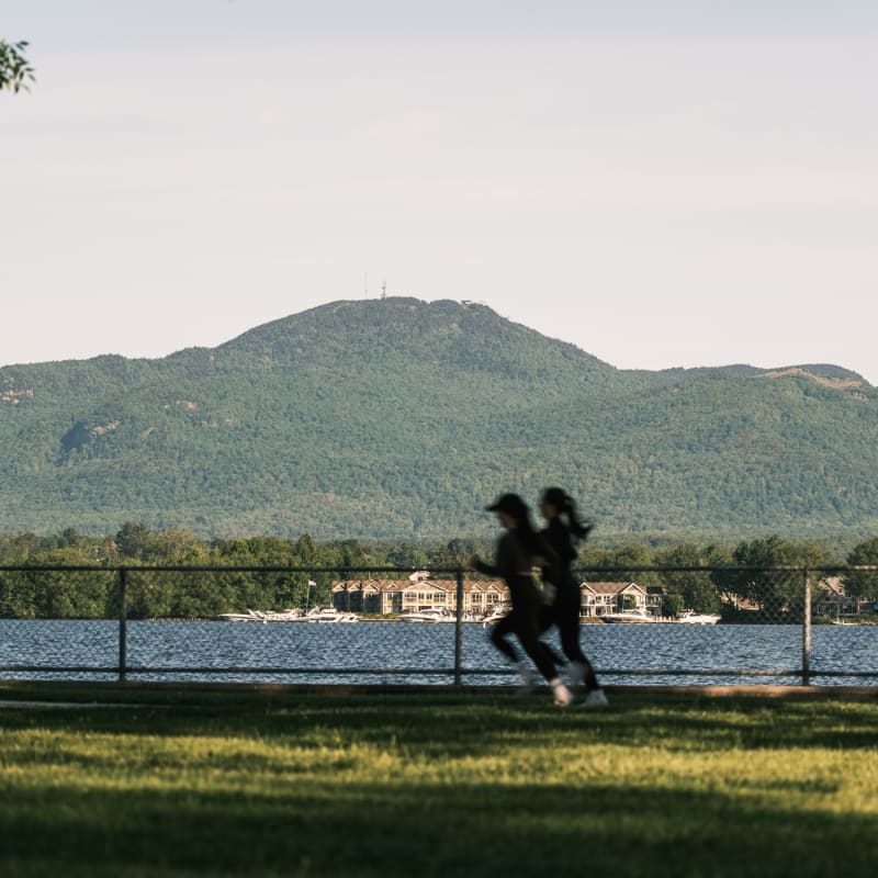 Two women jogging by the water