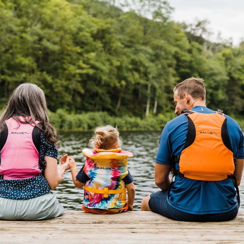 Kenauk Nature -  Two adults and a child on the edge of a quay, wearing life jackets