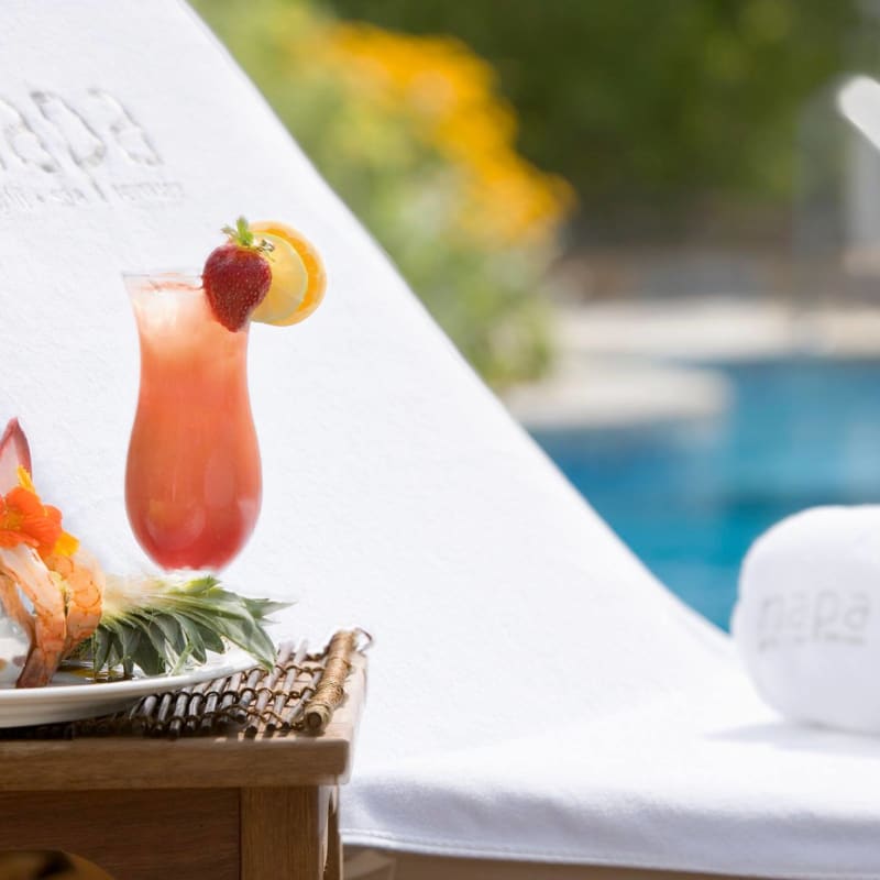 Tropical-looking cocktail and snack by the pool.