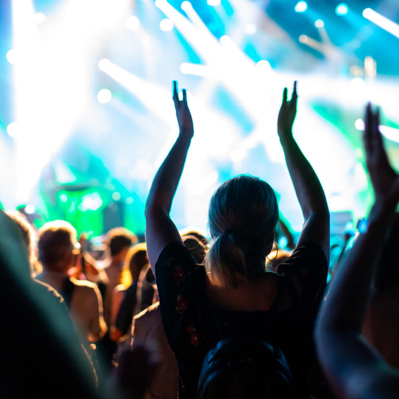 People clapping their hands at a festival
