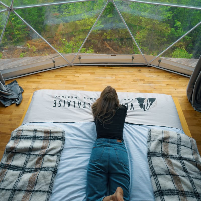 Girl on a bed in a dome
