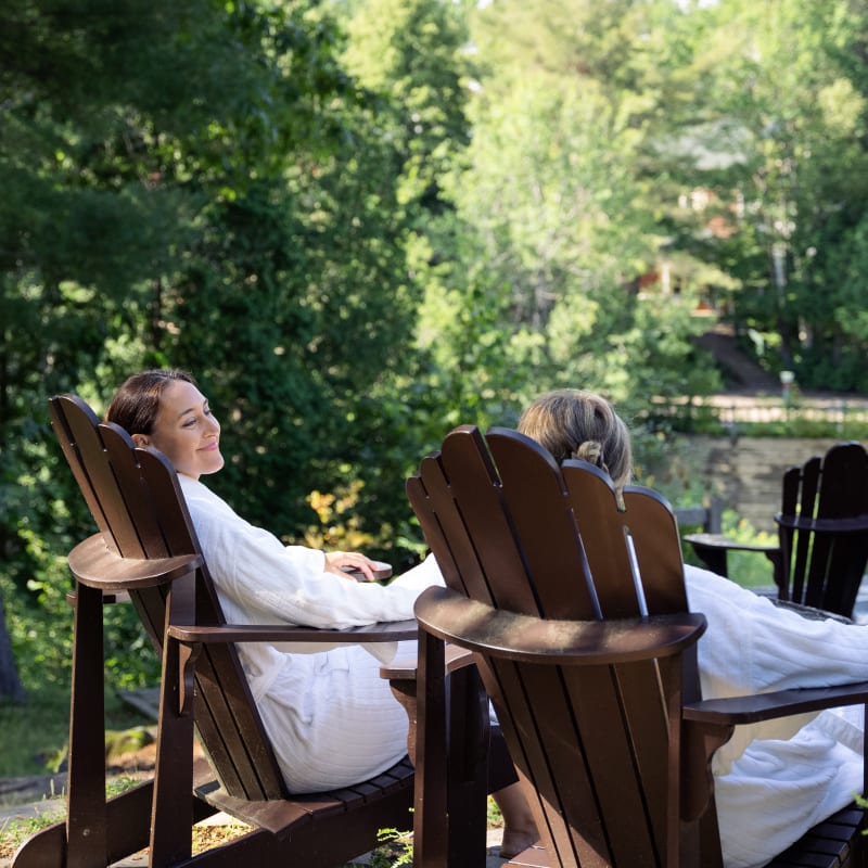 Two girls on chairs outside