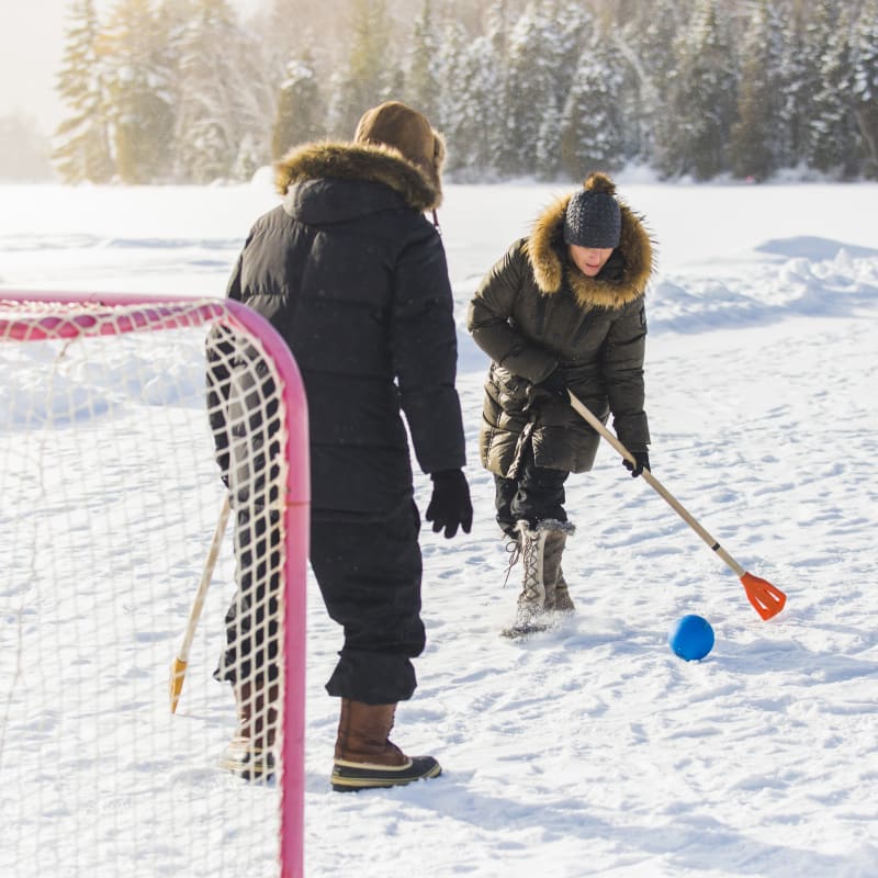 A couple playing in the snow