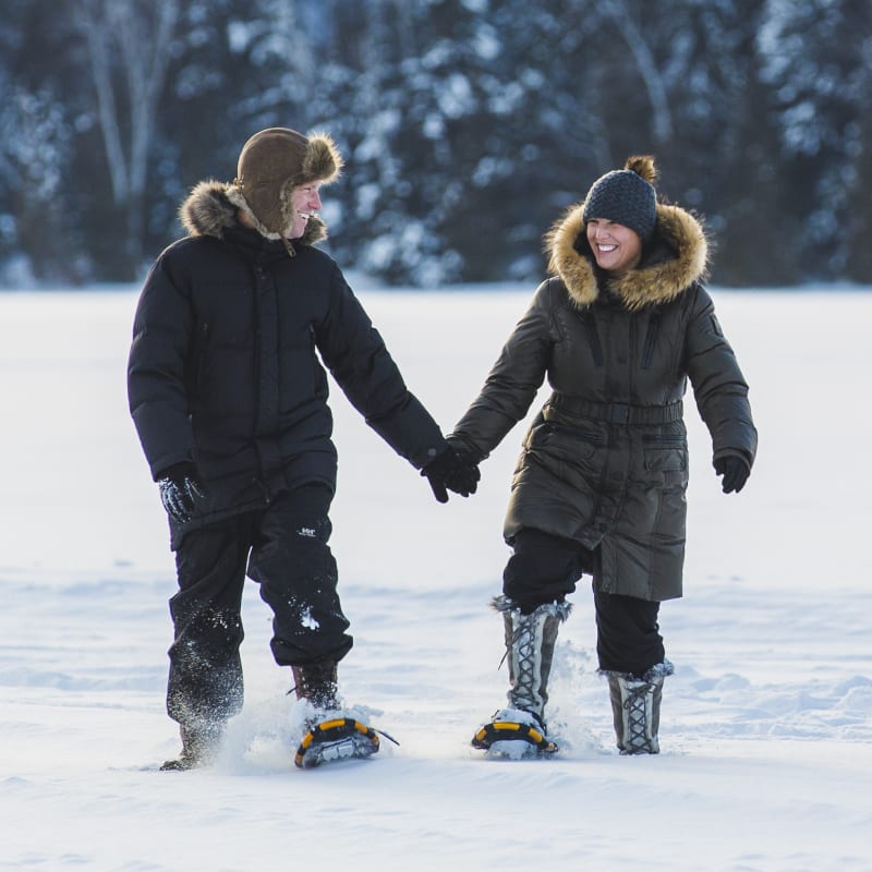 A couple snowshoeing